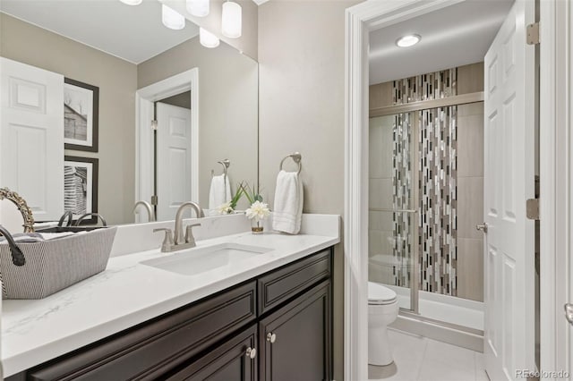 full bathroom with toilet, tile patterned floors, a shower stall, and vanity