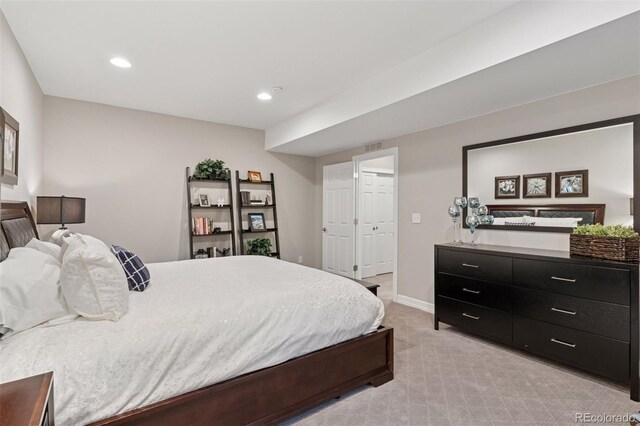 bedroom with baseboards, visible vents, recessed lighting, and light colored carpet