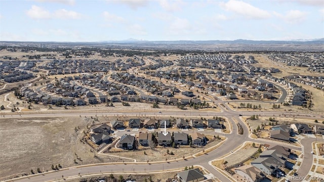 birds eye view of property with a residential view and a mountain view