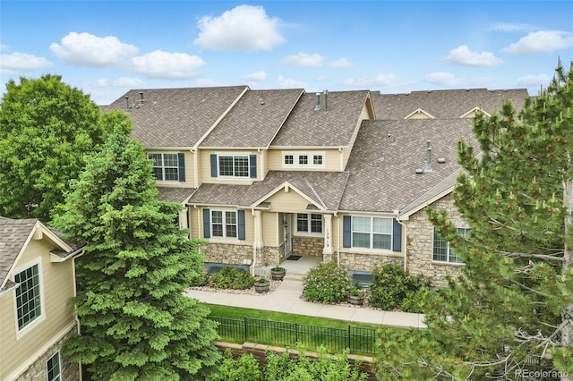 12919 W Burgundy Dr, Littleton, CO 80127 - view of front of property featuring stone siding and roof with shingles