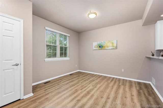 12919 W Burgundy Dr, Littleton, CO 80127 - spare room featuring light wood-style floors