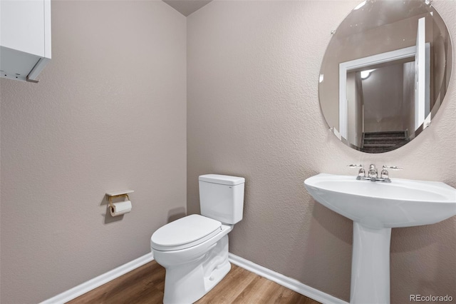 12919 W Burgundy Dr, Littleton, CO 80127 - bathroom with wood finished floors and toilet
