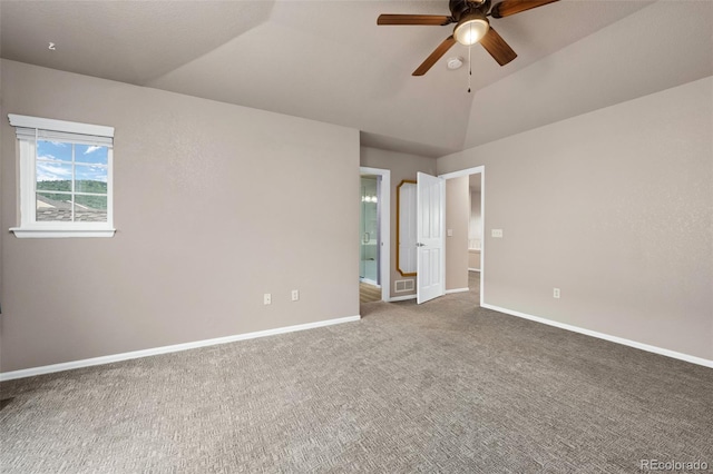12919 W Burgundy Dr, Littleton, CO 80127 - unfurnished bedroom with carpet floors, vaulted ceiling, and connected bathroom