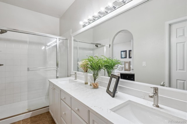 1441 S Ulster St, Denver, CO 80231 - bathroom with double vanity, a stall shower, and tile patterned flooring