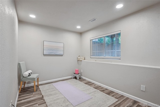 1441 S Ulster St, Denver, CO 80231 - sitting room with wood finished floors, baseboards, and recessed lighting