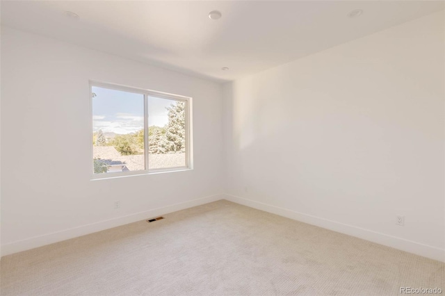 view of carpeted spare room