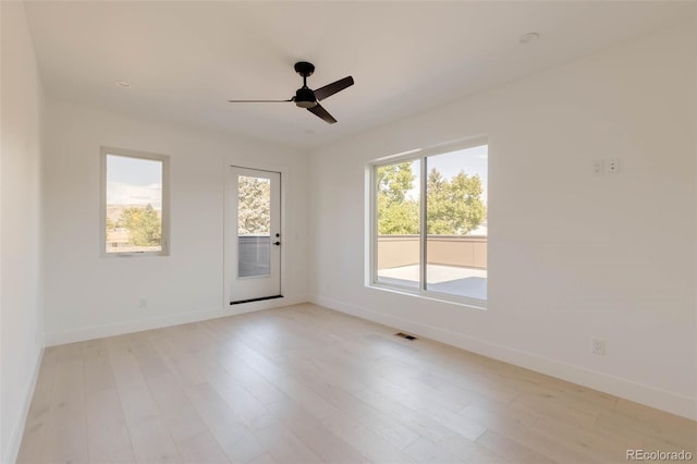 empty room featuring light wood-type flooring and ceiling fan