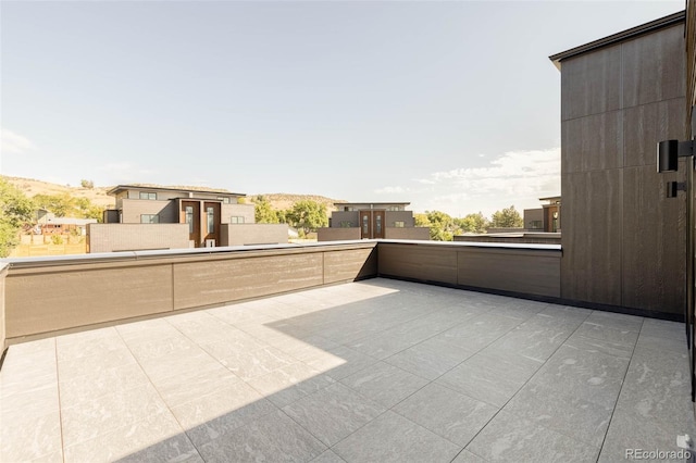 view of patio featuring a balcony