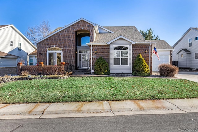 view of front of house featuring a garage and a front lawn