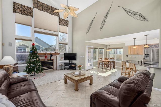 living room featuring light tile patterned floors, french doors, high vaulted ceiling, and ceiling fan