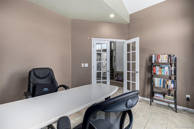 tiled home office with vaulted ceiling and french doors