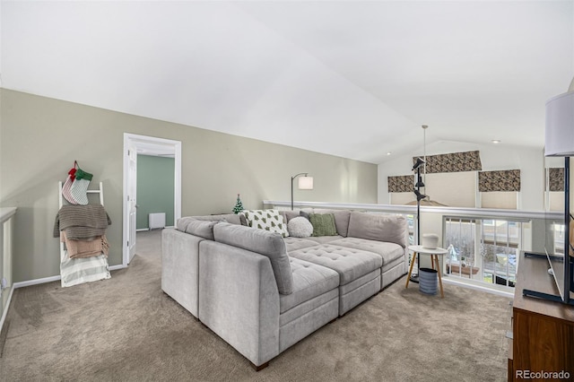 carpeted living room featuring lofted ceiling