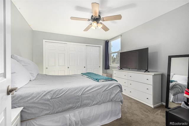 bedroom with dark colored carpet, a closet, and ceiling fan