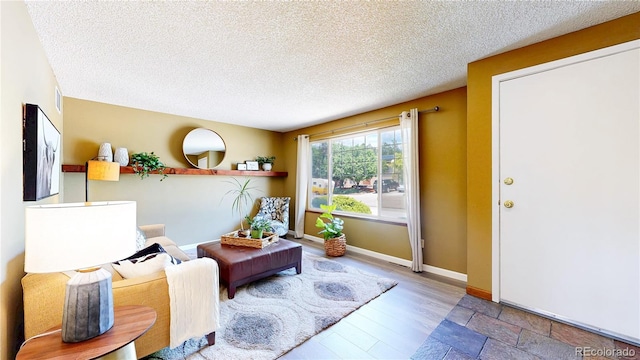 6836 W 79th Dr, Arvada, CO 80003 - living area featuring a textured ceiling and wood finished floors