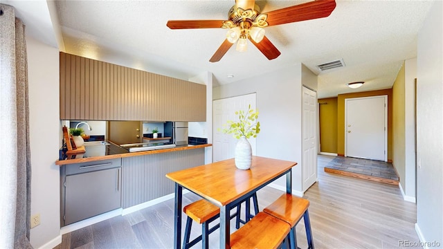 6836 W 79th Dr, Arvada, CO 80003 - kitchen featuring light wood-style flooring, ceiling fan, and freestanding refrigerator
