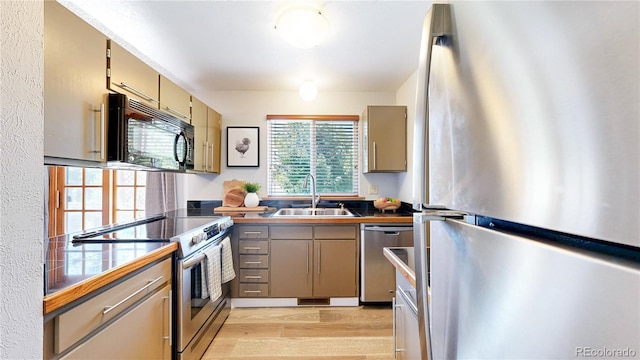 6836 W 79th Dr, Arvada, CO 80003 - kitchen featuring stainless steel appliances, light wood-type flooring, gray cabinets, and tile countertops