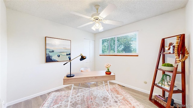 6836 W 79th Dr, Arvada, CO 80003 - office featuring a textured ceiling, wood finished floors, and ceiling fan