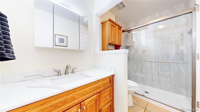 6836 W 79th Dr, Arvada, CO 80003 - full bath featuring vanity, a shower stall, and tile patterned flooring