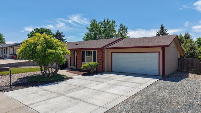 6836 W 79th Dr, Arvada, CO 80003 - ranch-style home with concrete driveway, an attached garage, and a shingled roof