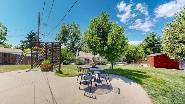 6836 W 79th Dr, Arvada, CO 80003 - fenced backyard with a patio area, a storage shed, and outdoor dining area