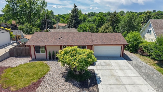 6836 W 79th Dr, Arvada, CO 80003 - single story home with concrete driveway, a garage, and a shingled roof