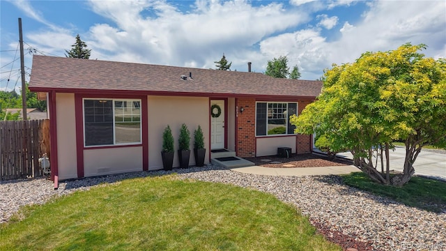 6836 W 79th Dr, Arvada, CO 80003 - ranch-style house with roof with shingles, stucco siding, and brick siding