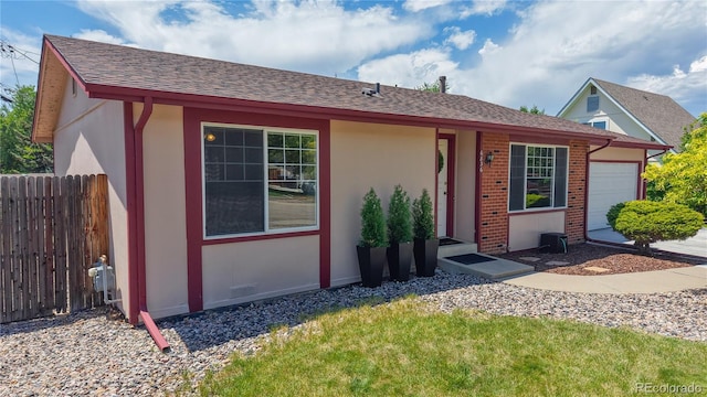 6836 W 79th Dr, Arvada, CO 80003 - ranch-style house featuring a garage, roof with shingles, and stucco siding