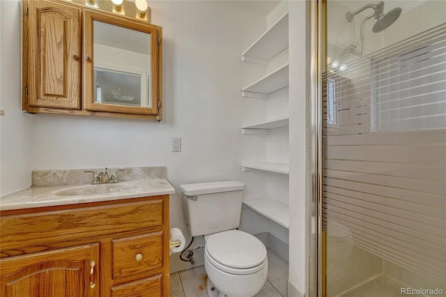 full bathroom featuring toilet, a stall shower, and vanity