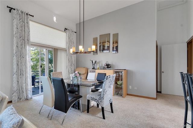 carpeted dining space featuring a chandelier and wine cooler