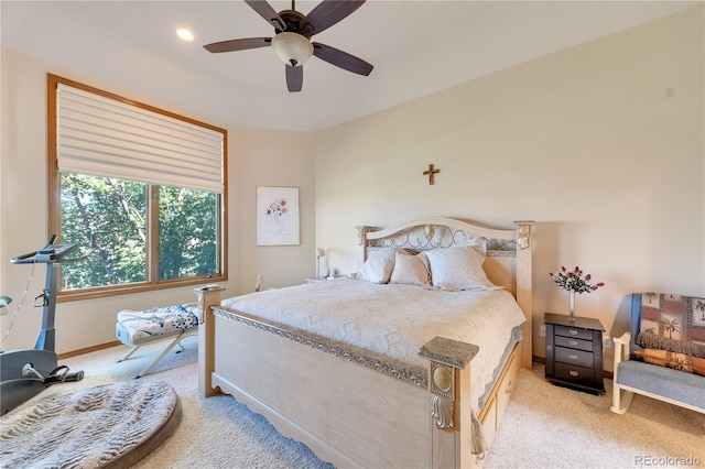 bedroom with light colored carpet and ceiling fan