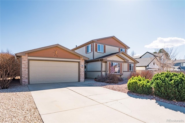 traditional home featuring an outbuilding, a garage, and driveway