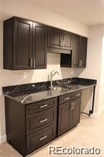 15305 W 93rd Ave, Arvada, CO 80007 - kitchen with a sink and baseboards