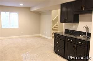 15305 W 93rd Ave, Arvada, CO 80007 - kitchen with light carpet, baseboards, a sink, dark countertops, and recessed lighting