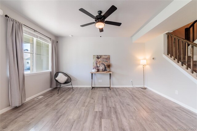 2640 Brookstone Dr Unit B, Milliken, CO 80543 - empty room with wood finished floors, stairs, and a ceiling fan