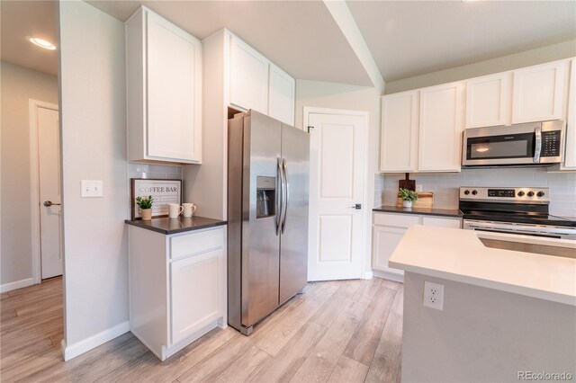 2640 Brookstone Dr Unit B, Milliken, CO 80543 - kitchen featuring stainless steel appliances, light wood-style floors, decorative backsplash, white cabinets, and recessed lighting