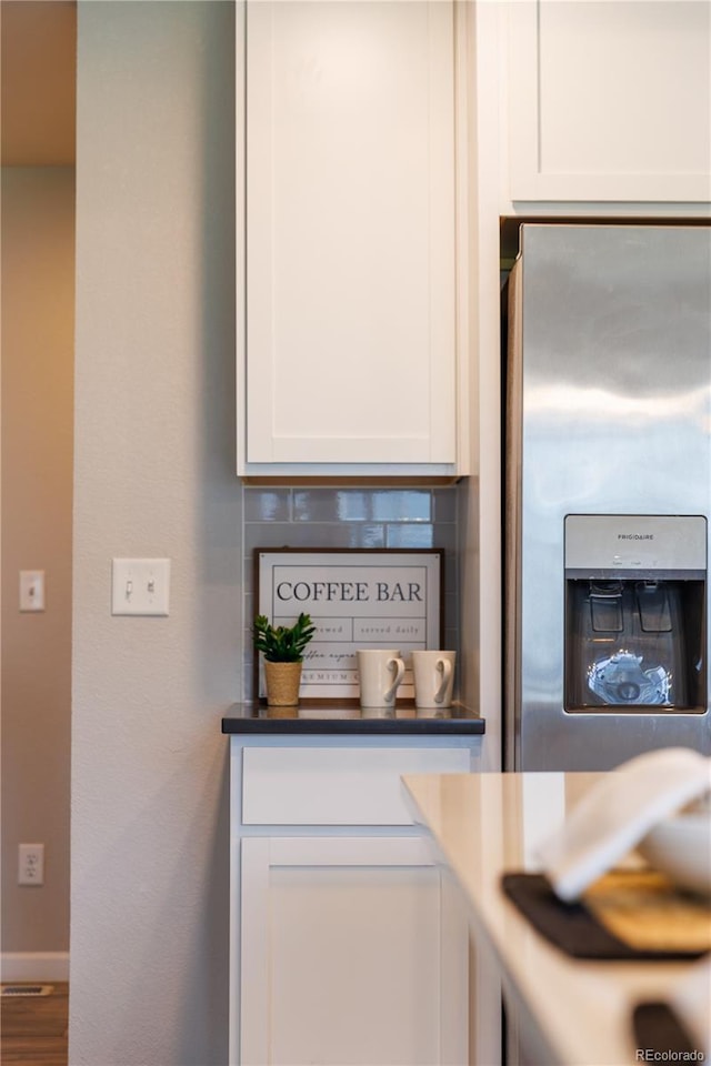2640 Brookstone Dr Unit B, Milliken, CO 80543 - kitchen view of stainless steel fridge and white cabinetry