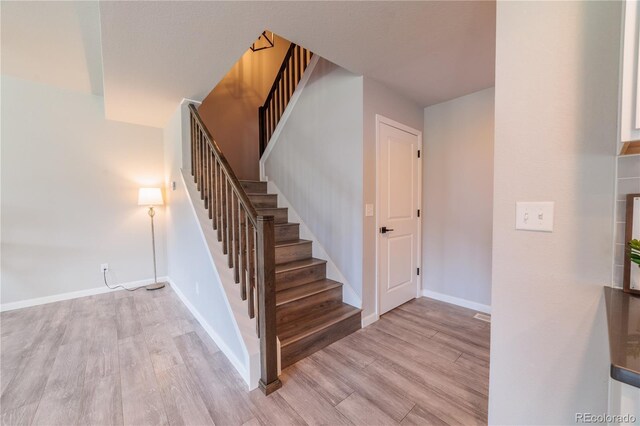 2640 Brookstone Dr Unit B, Milliken, CO 80543 - stairs featuring wood finished floors