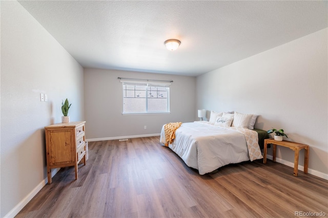 2640 Brookstone Dr Unit B, Milliken, CO 80543 - bedroom with wood finished floors and baseboards