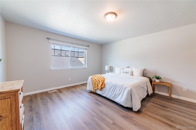 2640 Brookstone Dr Unit B, Milliken, CO 80543 - bedroom featuring wood finished floors