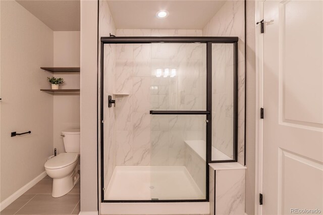 2640 Brookstone Dr Unit B, Milliken, CO 80543 - bathroom featuring a marble finish shower, tile patterned floors, and recessed lighting