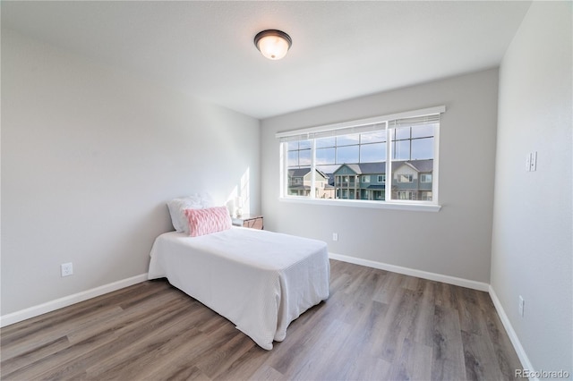 2640 Brookstone Dr Unit B, Milliken, CO 80543 - bedroom featuring wood finished floors and baseboards