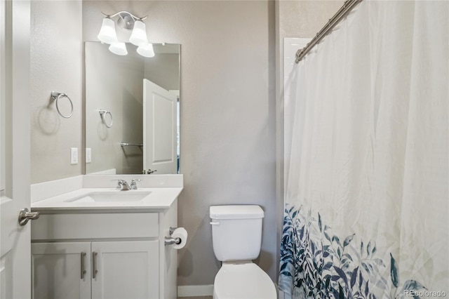 full bathroom with toilet, curtained shower, and vanity