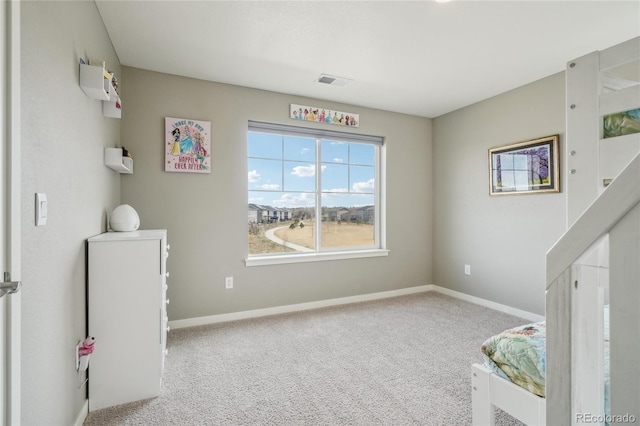 bedroom with carpet floors, baseboards, and visible vents