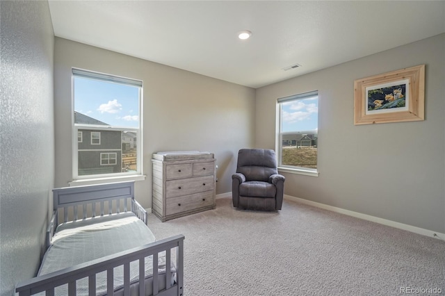 bedroom featuring visible vents, baseboards, and carpet floors