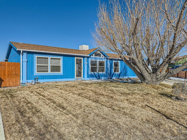 ranch-style home featuring a front yard