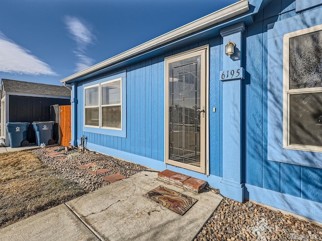 property entrance featuring a patio area