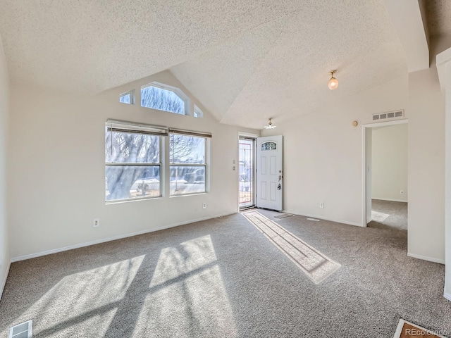 interior space featuring high vaulted ceiling and a textured ceiling