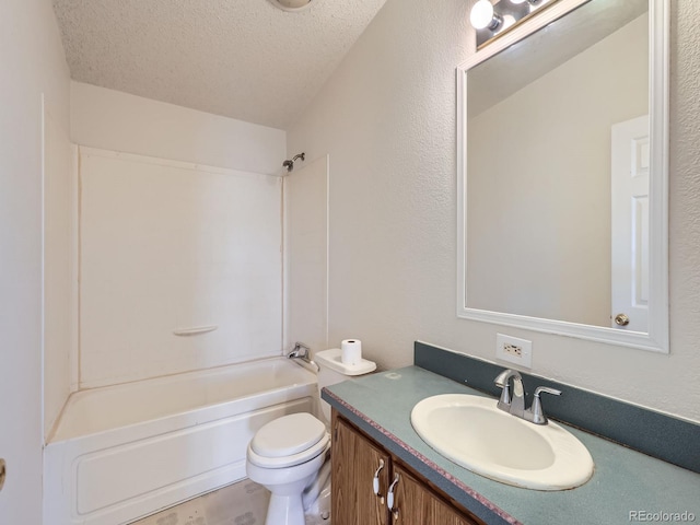 full bathroom with shower / bathing tub combination, vanity, toilet, and a textured ceiling