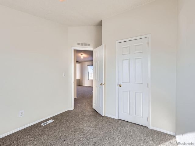 unfurnished bedroom with carpet flooring