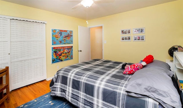 bedroom featuring hardwood / wood-style floors and ceiling fan